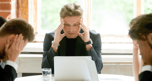 Employees gathered around stressing about data loss
