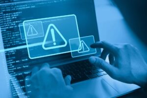 laptop with system hacked alert