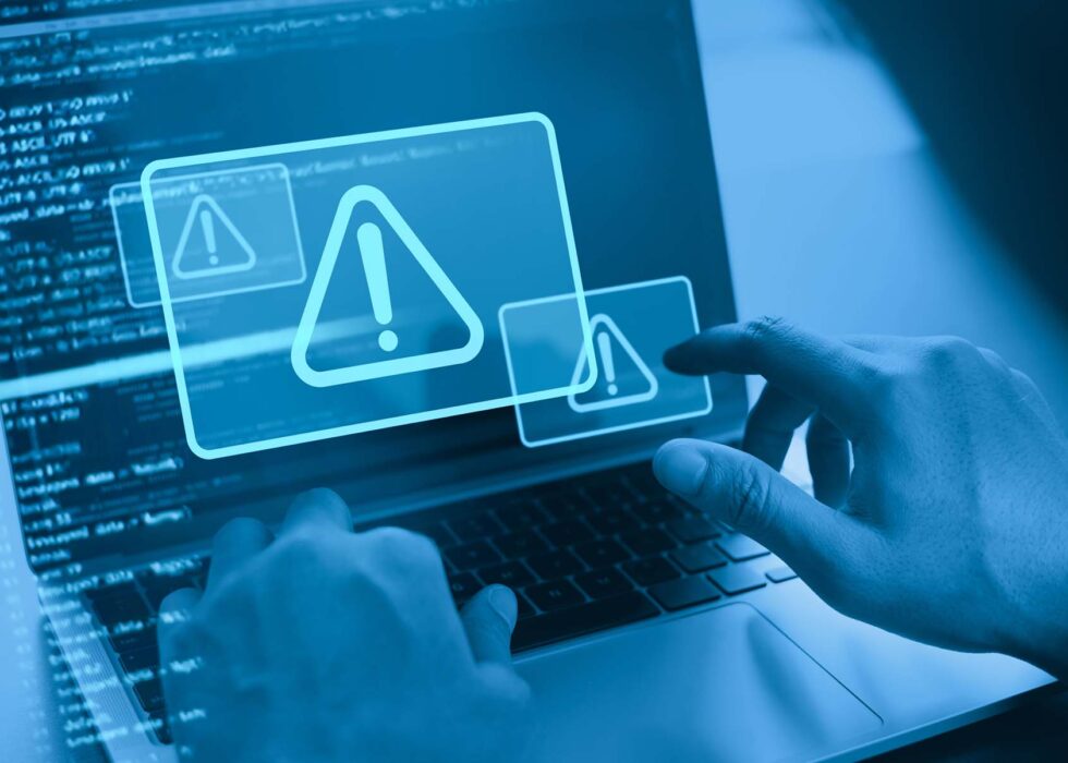 laptop with system hacked alert